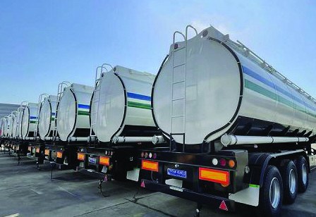 Stainless steel tankers lined up at a loading terminal